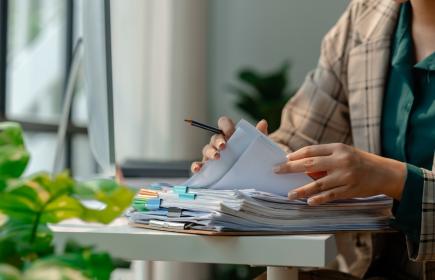Person filling out forms