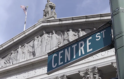 Centre St sign board looming over New York State Supreme Court Building