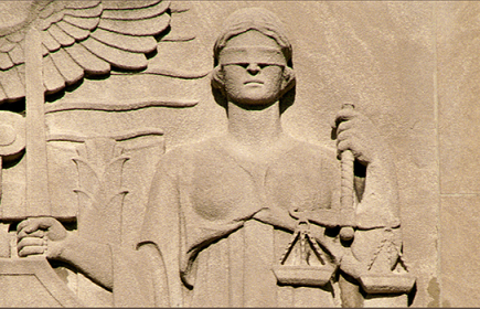 Photo of a sculpture relief of Lady Justice