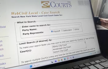 Photo of laptop with the WebCivil Local Case Search Screen
