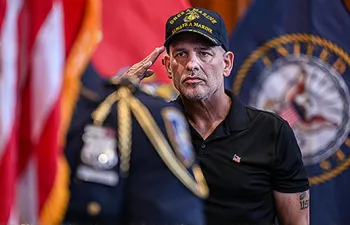 Photo of a military veteran saluting
